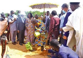 Ehunabobrim Pra Agyensiam planting a tree after cutting the sod for the commencement of the eye care centre