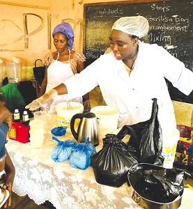 Christabel Afia Timah Sarpong, Chief Executive Officer of Coded Fresh Yogurt,  teaching some participants how to make the product