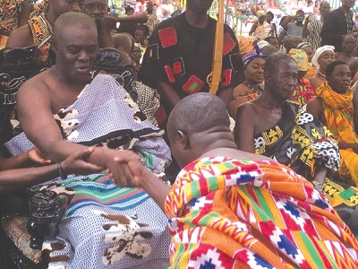 Oseadieyo Agyemang Badu II (left), President of the Bono Regional House of Chiefs, exchanging pleasantries with Ansu Kumi (back to camera), the Sunyani Municipal Chief Executive