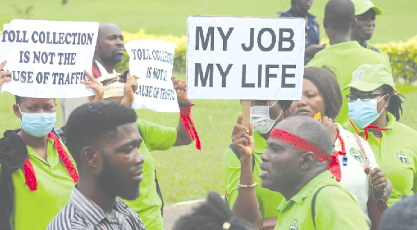 Some of the members of the Tolls Workers of Ghana carrying placards to express their grievance
