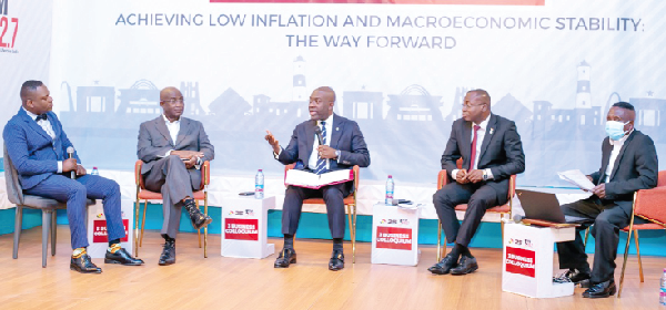 Kojo Oppong Nkrumah (middle), Minister of Information, making a comment during the colloquium 