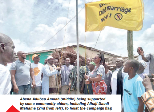 Abena Adubea Amoah (middle) being supported by some community elders, including Alhaji Daudi Mahama (2nd from left), to hoist the campaign flag