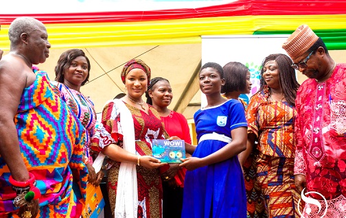 Samira Bawumia (4th from left), Founder of Samira Empowerment and Humanitarian Project, presenting one of the books to a beneficiary from the St Peter’s Anglican Basic School.