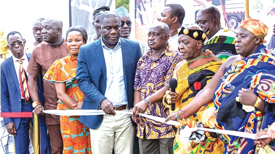 Opagyakotwere Bonsra Afriyie II (2nd from right), Simon Osei-Mensah (3rd from right) and Eric Asubonteng, Managing Director of AGA, cutting the  tape to symbolically launch the plan