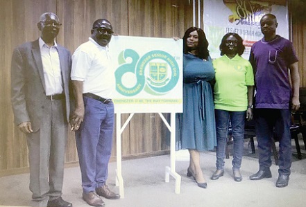Samuel Aryee (2nd from left), Board Chairman of Ebenezer SHS; Kate Addo (3rd from right), the Director of Public Affairs of Parliament, and Anastasia Konadu, the Headmistress of the school, unveiling the 80th anniversary logo