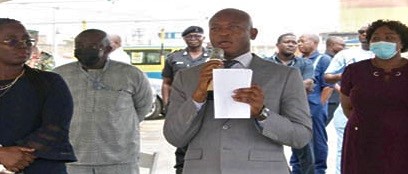 Michael Luguje holding the paper he said was the letter from MPS while addressing the workers. Picture:  DELLA RUSSEL OCLOO
