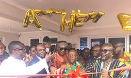 Ogyeahohoo Yaw Gyebi II (middle) being assisted by the Banahene  twins (arrowed and 2nd from left), Carlos Ahenkorah (3rd from right) and Akwasi Agyeman (right) to inaugurate the hospital