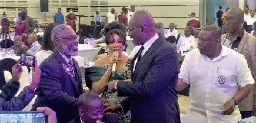 Kennedy Ohene Agyapong, Member of Parliament for Assin Central, exchanging pleasantries with Solomon Afum, Premium Spirits Brand Manager, Diageo Ghana, after making the first bid for the Johnnie Walker whiskey