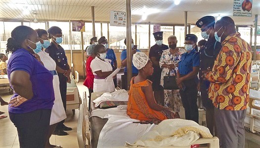  Members of the Customs Ladies Club at the bedside of one of the beneficiaries of the financial support. With them is Dr Richard Anthony (right), Medical Director, Tema General Hospital. Picture: BENJAMIN XORNAM GLOVER