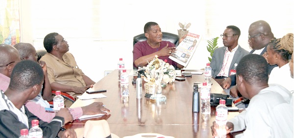 Kobby Asmah (middle), Editor, Graphic, explaining a point during the meeting with the delegation from the Science and Technology Institute of Information and Communications. With him are Arsene Evariste Kabore (4th from left), Secretary General, ISTIC, Theophilus Yartey (3rd from right), Deputy Editor, Daily Graphic, Emmanuel Arthur (4th from right), Corporate Communications Manager, GCGL, and other members of the delegation. Picture: Maxwell Ocloo