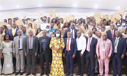 Professor Rita Akosua Dickson (5th from left), Vice-Chancellor, KNUST; Prof. Ellis Owusu-Dabo (5th from right), Pro Vice-Chancellor, KNUST, and some dignitaries with some of the beneficiaries after they received free brand new laptops. Picture: EMMANUEL BAAH