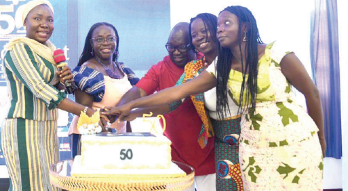 Prof. Nana Aba Appiah Amfo (2nd from left), Vice-Chancellor, University of Ghana (UG), being assisted by Fatimatu Abubakar (left), Deputy Minister of Information, Dr Abena Animwaa YeboahBanin (2nd from left), Head, Department of Communication Studies, UG, Prof. Martin Oteng-Ababio (3rd from right), Provost, College of Education, UG, and Prof. Akosua Keseboa Darkwah (right), Dean, School of Information and Communication Studies, to cut the 50th anniversary cake. Picture: MAXWELL OCLOO