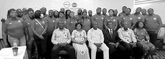Morgan Ayawine (seated 3rd from right), General Secretary of the Industrial and Commercial Workers Union, with the union executive and union members of Absa Bank Ghana