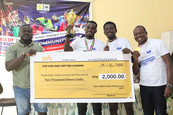 The winners with their cheque 