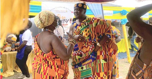 Nana Amba Eyiaba I, Krontihemaa of Oguaa Traditional Area, exchanging pleasantries with Odeefuo Amoakwa Buadu VIII (right), President of the Central Regional House of Chiefs, at the Fair