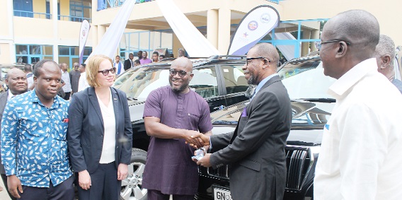 Andrew Egyapa Mercer (middle), Deputy Minister of Energy, presenting the keys of the vehicle to Prof. George Yaw Obeng, Dean, Faculty of Mechanical & Chemical Engineering, KNUST. Picture: ERNEST KODZI