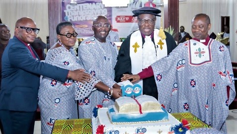 Vice-President Dr Mahamudu Bawumia (middle), joined by Rt Rev. Prof. Joseph Obiri Yeboah Mante (2nd from right), the Moderator of the General Assembly of the PCG, together with other church members to cut the 100 years anniversary cake at Akropong