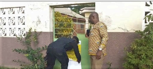 Joseph Appiagyei (right), Bono, Bono East and Ahafo Regional Director of the Ghana Tourism Authourity, supervising the closure of one of the facilities in the Bono Region