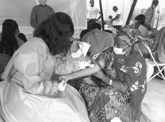 A health worker taking a community member through the screening exercise