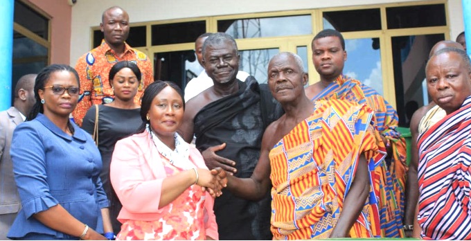 Daasebre Akuamoah Agyepong II (2nd from right) and Gloria Opoku Anti (2nd from left) with members of the traditional council and management of the company
