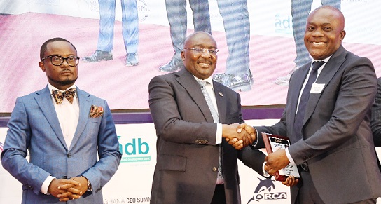 Dr Mahamudu Bawumia presenting the 2021 Best CEO, Real Estate Category, to Dr James Orleans-Lindsay (right), CEO and Executive Director of JL Properties, during the 6th Ghana CEO Summit in Accra. With them is Ernest De-Graft Egyir, President and CEO of Chief Executives Network. Picture: EBOW HANSON  