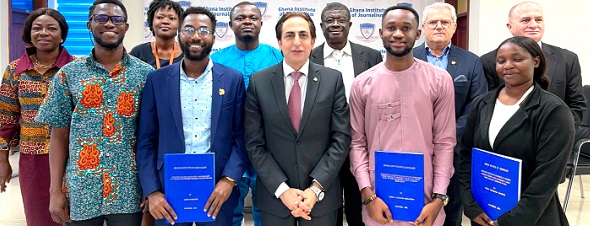 Ambassador Maher Kheir (middle) and Dr Adu Bempah Brobbey (3rd from right back roll) with the beneficiaries (with blue files) and some staff of the embassy and GIJ.