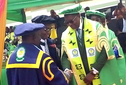 Prof. Eric Nyarko-Sampson(right), VC of the University of Environment and Sustainable Development, being congratulated by some Vice-Chancellors of other institutions after his investiture
