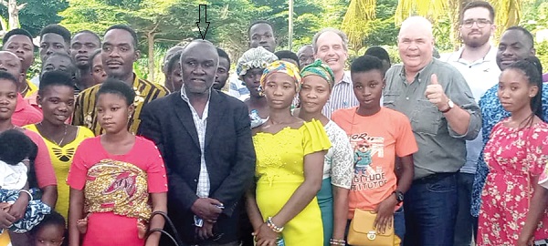 Rudolf Buhler (2nd from right), President of Ecoland International, and Dr Charles Brempong Yeboah (arrowed), Acting Rector of the University College of Agriculture and Environmental Studies, with the beneficiary farmers