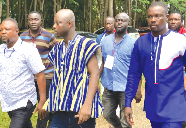  Abronye (In smock) entering the Catholic Pastoral Centre before the election