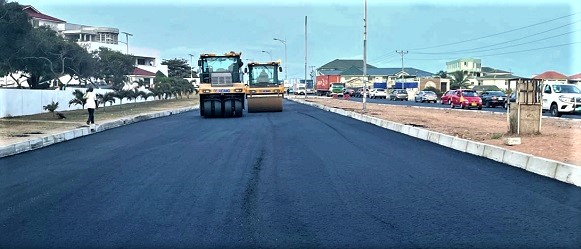 Compaction equipment being used on the asphalt overlay of the Accra-Tema Beach Road Project