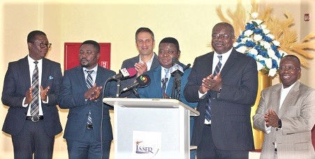 Prof. Ernest Aryeetey (2nd from right), former Vice-Chancellor of the University of Ghana; Prof. Peter Quartey (3rd from right), Director of the Institute of Statistical, Social and Economic Research, UG; Dr Seth Garz (3rd from left), Senior Programme Officer for Research, Bill and Melinda Gates Foundation; Prof. Francis Annan (2nd from left), Georgia State University, USA, and other team members of the Retail Finance Distribution Research Initiative, applauding after the launch of the ReFinD. Picture: Maxwell Ocloo
