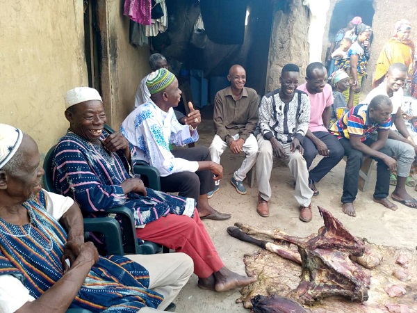 Elders and some people of Tuna (Donguzie) performing rites for a deceased person