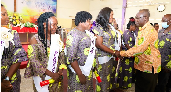 Isaac Kofi Egyir (right), Director-General of the Ghana Prisons Service, congratulating Patience Baffoe-Bonnie (4th from left), National  President of the Prisons Ladies Association, and others after the induction ceremony. Picture: GABRIEL AHIABOR