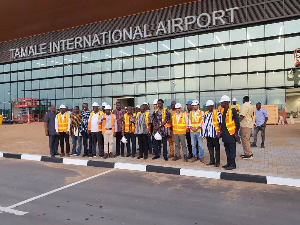 Vice President Dr. Mahamudu Bawumia during his visit to the new Tamale International Airport is seen posing with workers at the new facility..