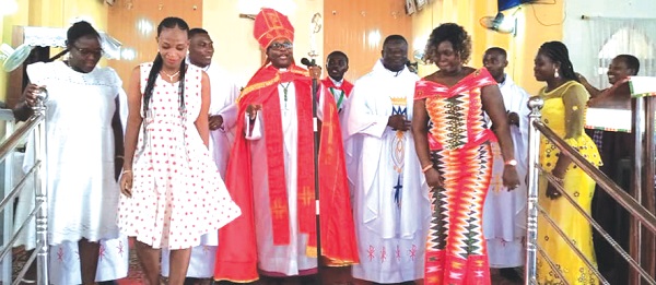 Rt Rev Felix Odei Annancy (middle), the Bishop of the Koforidua Diocese of the Anglican Church, together with the four ordained priests and their spouses last Sunday