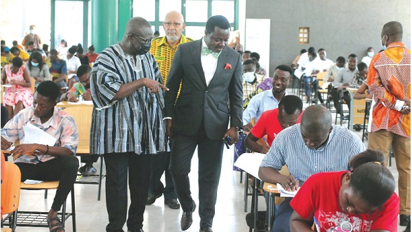 Kwabena Amankwa Asiamah (left), Chairman of the Education Committee in Parliament, and Rev John Ntim Fordjour (2nd from left), a Deputy Minister of Education, observing students during the licensure exams at the Accra Training College of Education. Also in the photograph is Anis Haffar (in yellow), Board Chairman of the NTC. Picture: Maxwell Ocloo
