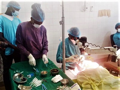  Dr Lordson Dagba (right), the Upper East Regional Ophthalmologist, operating on one of the residents