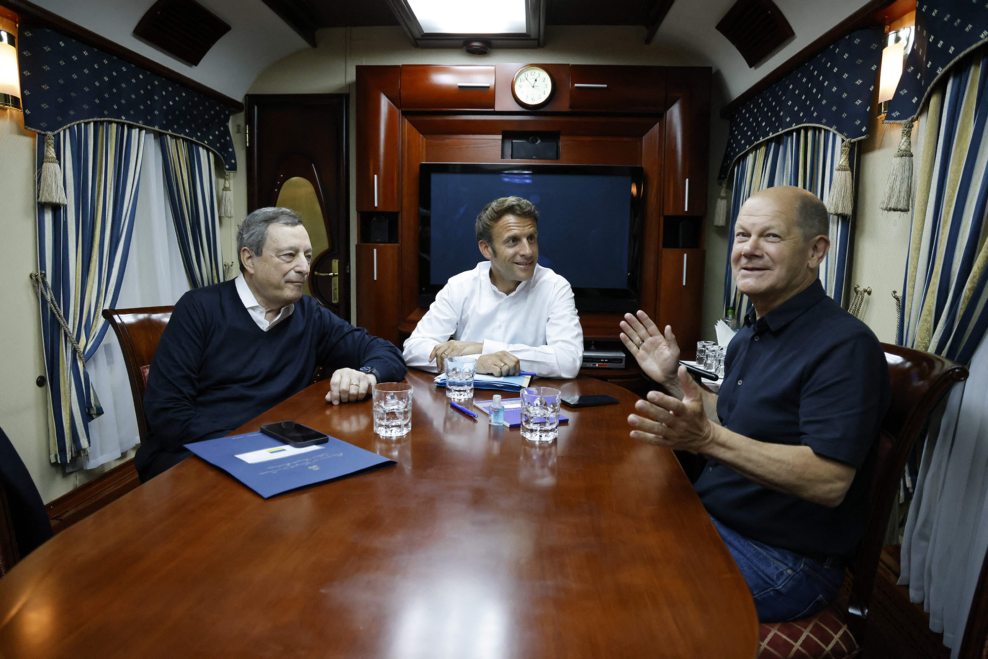 From left, Italian Prime Minister Mario Draghi, French President Emmanuel Macron and German Chancellor Olaf Scholz travel on board a train bound to Kyiv after departing from Poland on June 16.