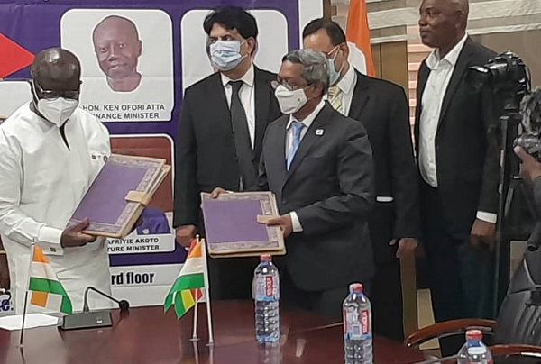 Ken Ofori-Atta (left), the Finance Minister, and G. Selva Kumar (right), Resident Representative of the India EXIM Bank, displaying the signed documents 