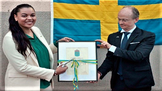  Carl Michael Grans (right), Swedish Ambassador to Ghana, Nigeria, Cameroon, ECOWAS, handing over the official diploma to Nickie Akosa, the Honorary Consul of the Honorary Consulate of Sweden in Accra. Picture: Maxwell Ocloo