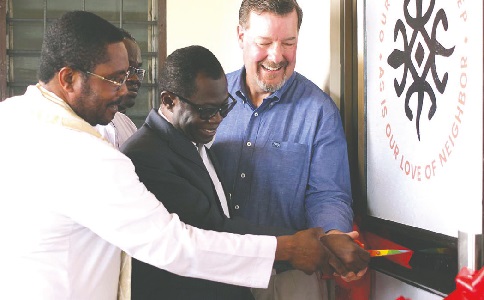 Prof. Samuel Kwame Offei (middle), Board Chairman, The Sanneh Institute, cutting a tape to inaugurate the multi-religious library. Assisting him are Dr Chris Seiple (right), President Emeritus, Institute of Global Engagement, and the Very Rev. Gabriel Kojovi Liashiedzi, Executive Secretary, Department of Pastoral Ministry and Evangelisation, Ghana Catholic Bishops Conference. Picture: MAXWELL OCLOO