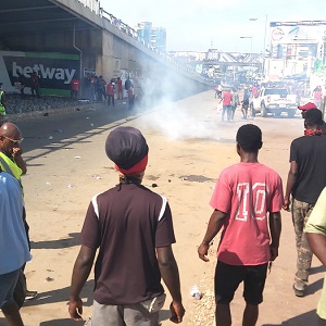 Some of the demonstrators looking at the tear gas fired by the police
