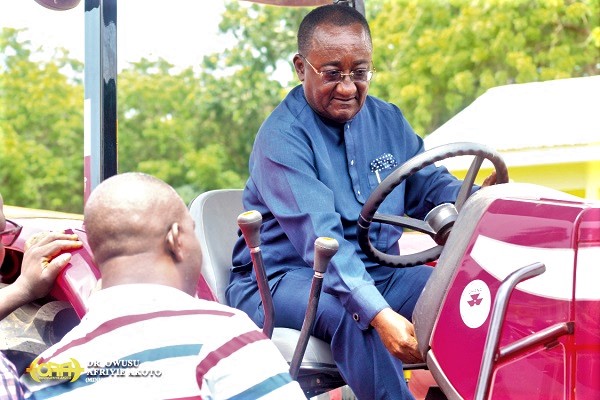  Dr Owusu Afriyie Akoto, Minister of Food and Agriculture, testing one of the tractors