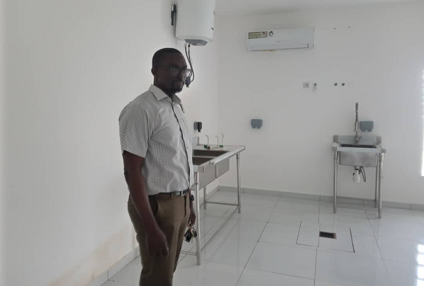 Dr Fred Aboagye-Antwi, the In-Country Principal for Target Malaria team in Ghana, conducting this reporter around the insectaries lab at the University of Ghana