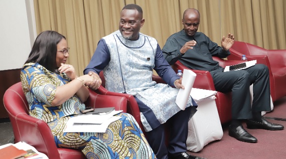Dr John Kumah (middle), a Deputy Minister of Finance, shaking hands with Stella Dede Williams (left), acting Coordinating Director, Operations, Ministry of Finance. With them is Dr Patrick Nomo (right), Chief Director, Ministry of Finance. Picture: SAMUEL TEI ADANO