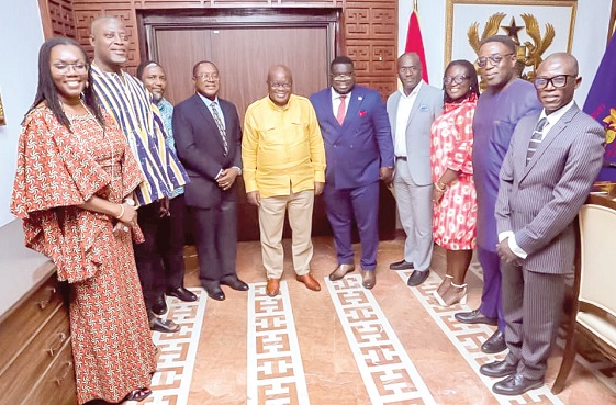 Ursula Owusu-Ekuful (left), Minister of Communications and Digitalisation, led a team of board and management of Ghana Post to present a scuttle box to the President Akufo-Addo