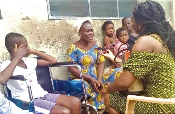 Loislyn (left, in wheel chair), with Adwoba (2nd from left), her mother, being interviewed by Elizabeth Konadu-Boakye