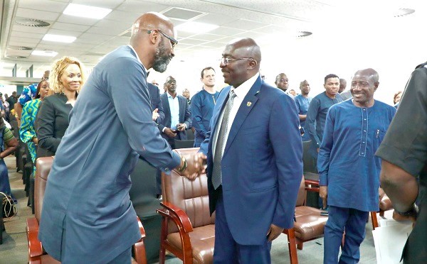 Dr Mahamudu Bawumia in a handshake with Ralph Mupita, President and CEO of MTN Group. Looking on is Ebenezer Asante Dr Mahamudu Bawumia in a handshake with Ralph Mupita, President and CEO of MTN Group. Looking on is Ebenezer Asante