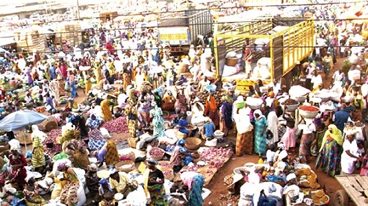 A market place with hordes of traders and buyers