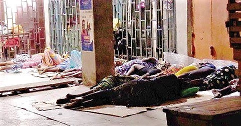 Some Kayayei sleeping in front of a shop at Darkuman in Accra Some Kayayei sleeping in front of a shop at Darkuman in Accra